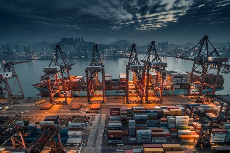 Container terminal with gantry cranes at dusk
